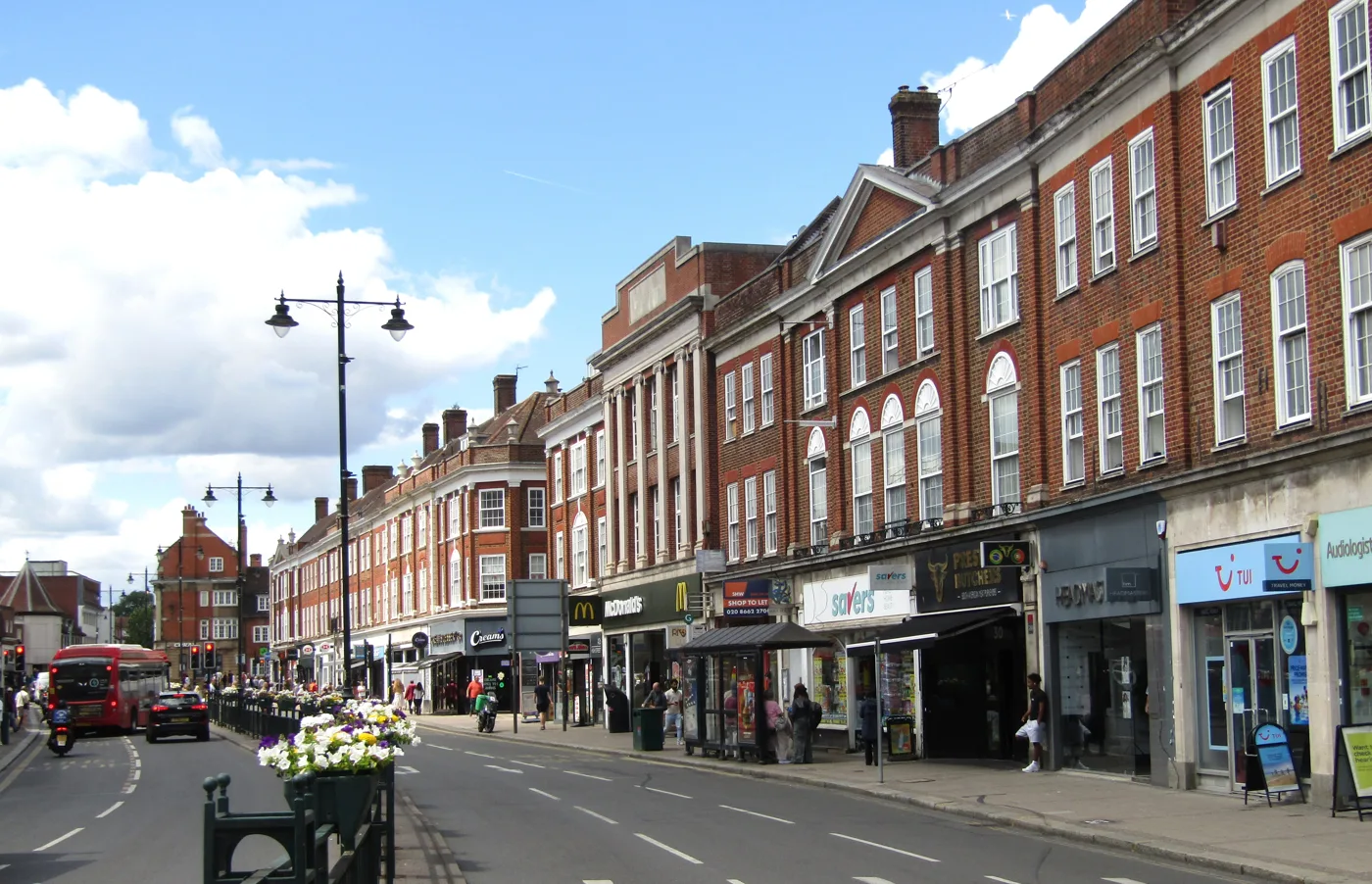 Epsom High Street. The town's own switch-on is on the Market Place at the far end, on Friday 20 November 2026